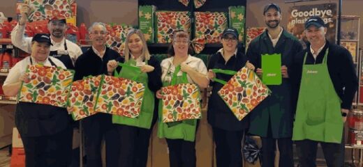 A picture of Sobeys employees standing together and holding Sobeys reusable bags in their hands.