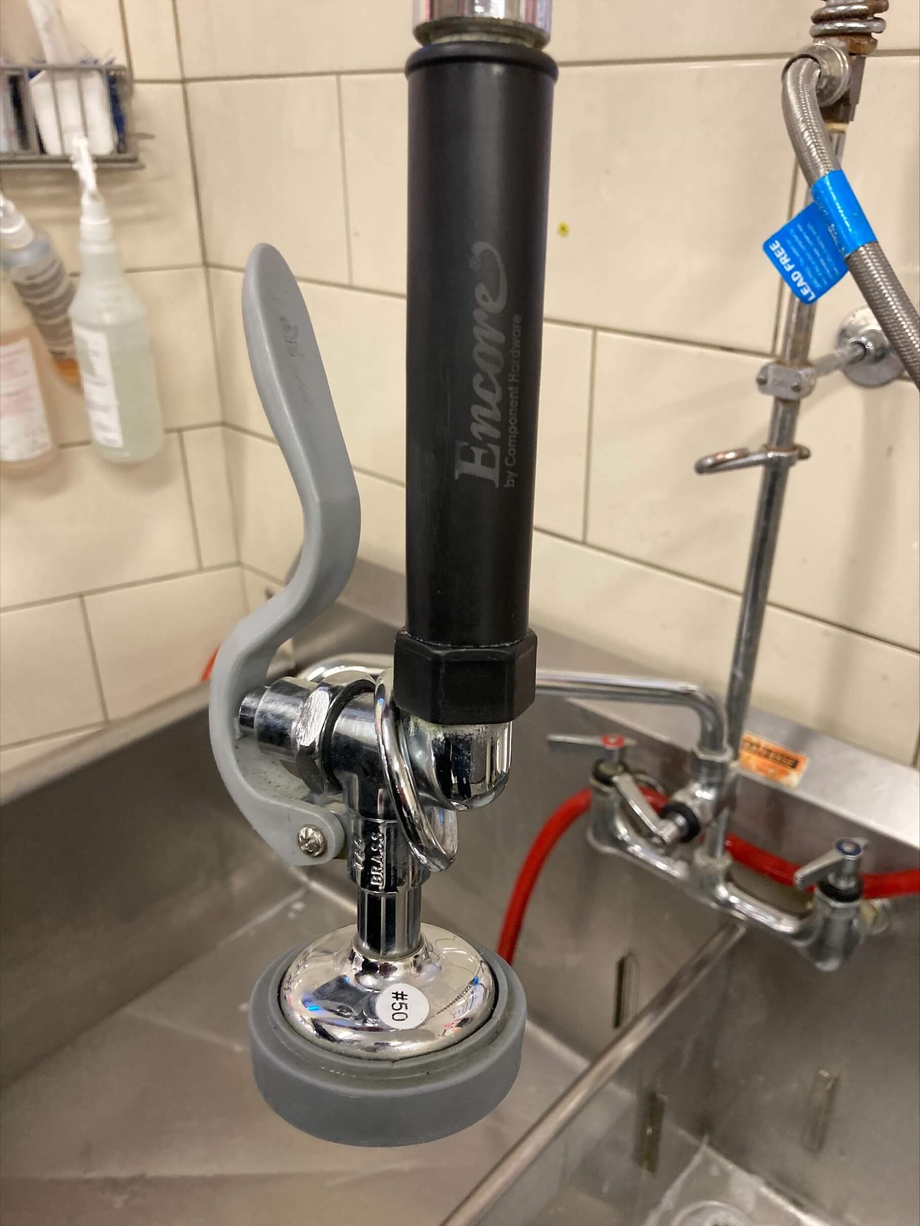 Low-flow spray valve on a faucet
