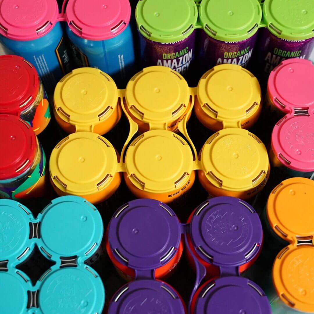 A picture of some colorful containers placed in rows.