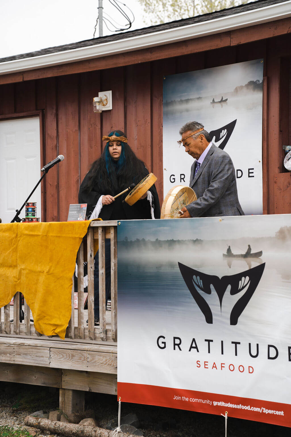 A picture of two persons playing an instrument on Gratitude Day.